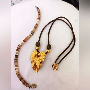 Gold Leaf on a leather chain and pooka beads bracelet never worn